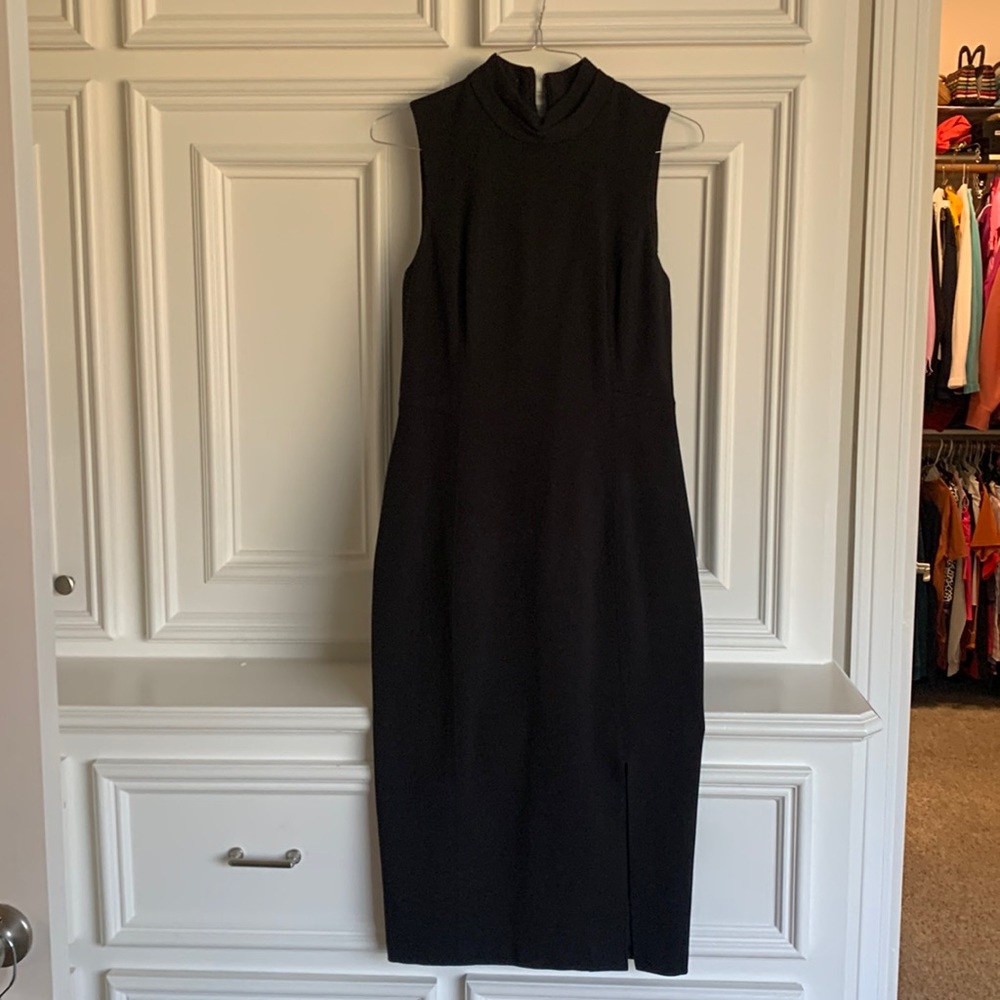 Beautiful black dress 44 inches long and 18 pit to pit.
